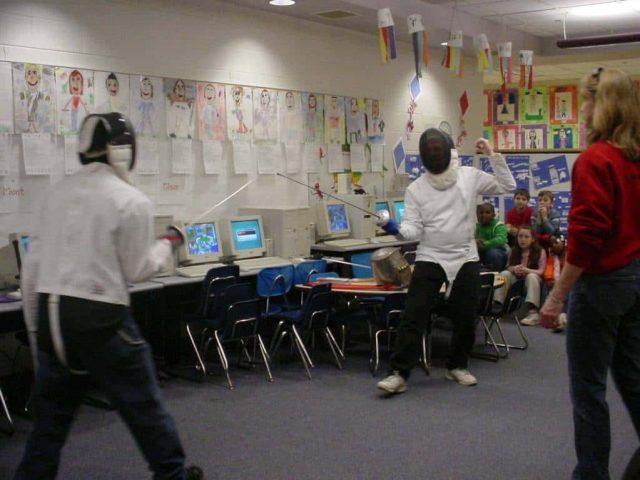 fencers do their thing in a classroom